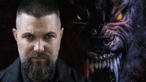 Close up Portrait of a Bearded Man on the Left with a Dark Snarling Purple Monster Emerging from the Right Side Behind Him