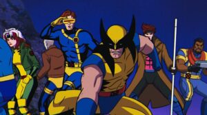 Group of Colorful Superheroes Sprinting Toward the Viewer Led by a Muscular Wolverine like Character in Brown and Yellow with Clawed Gloves Under a Dark Blue Night Sky