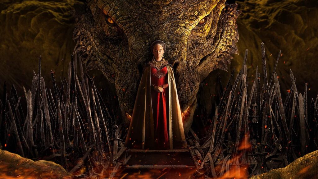 Woman in a Red Gown with a Gold Cape Stands Before a Towering Dragon Head in a Lava lit Cavern Flanked by Jagged Black Swords