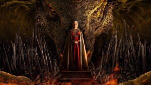 Woman in a Red Gown with a Gold Cape Stands Before a Towering Dragon Head in a Lava lit Cavern Flanked by Jagged Black Swords