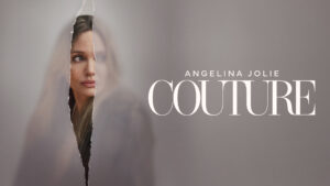 Angelina Jolie Peeking Through a Torn Paper in a Muted Grey Ad for Couture Fashion