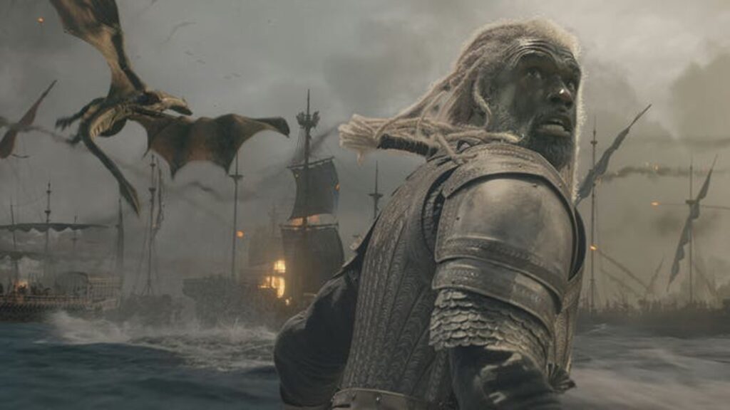 Armored Long haired Humanoid Stands in Churning Water As Burning Ships and Flying Dragons Fill a Stormy Battlefield Behind Him