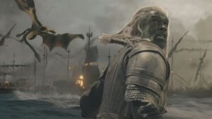 Armored Long haired Humanoid Stands in Churning Water As Burning Ships and Flying Dragons Fill a Stormy Battlefield Behind Him