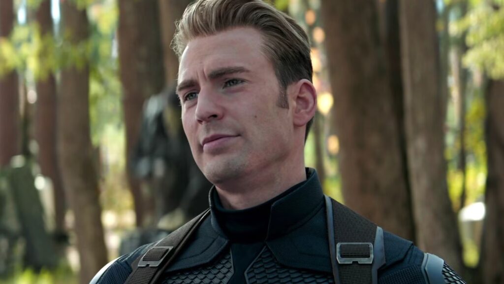 Close up of a Man in Dark Tactical Gear Standing in a Sunny Forest Looking off to the Side