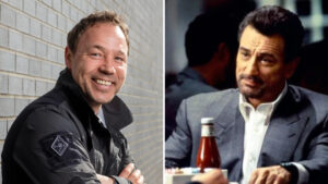 Smiling Man in a Black Jacket Leaning Against a Light Brick Wall left Image