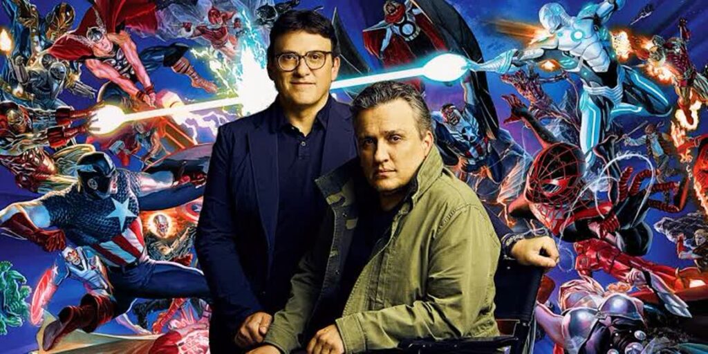 Two Men Pose in Front of a Vibrant Superhero Collage Suggesting a Comic Book Collaboration or Interview