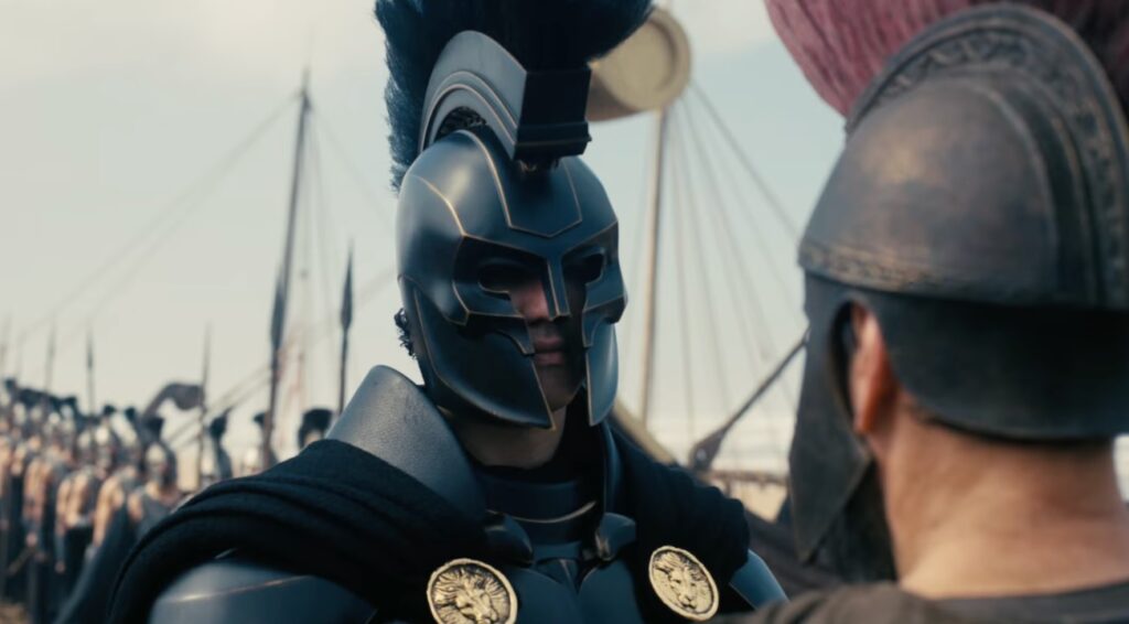 Armored Warrior in a Dark Spartan style Helmet Speaks to a Companion on a Battlefield with Rows of Soldiers in the Background on a Ship Deck