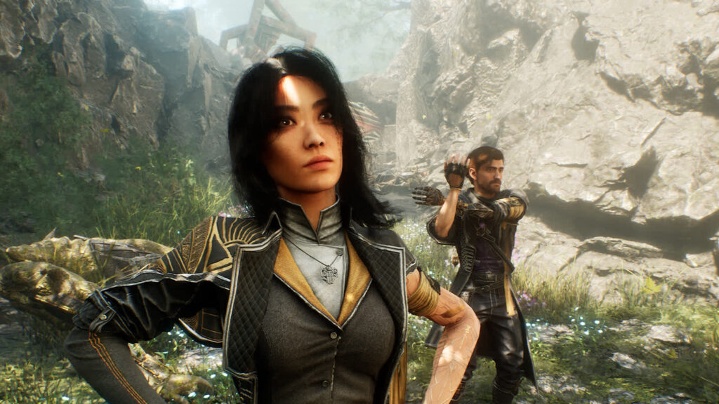 a Female Warrior in Detailed Armor Stands in the Foreground with a Rocky Canyon and Overgrown Plants Behind Her While a Bearded Male Fighter Raises His Arms in the Background