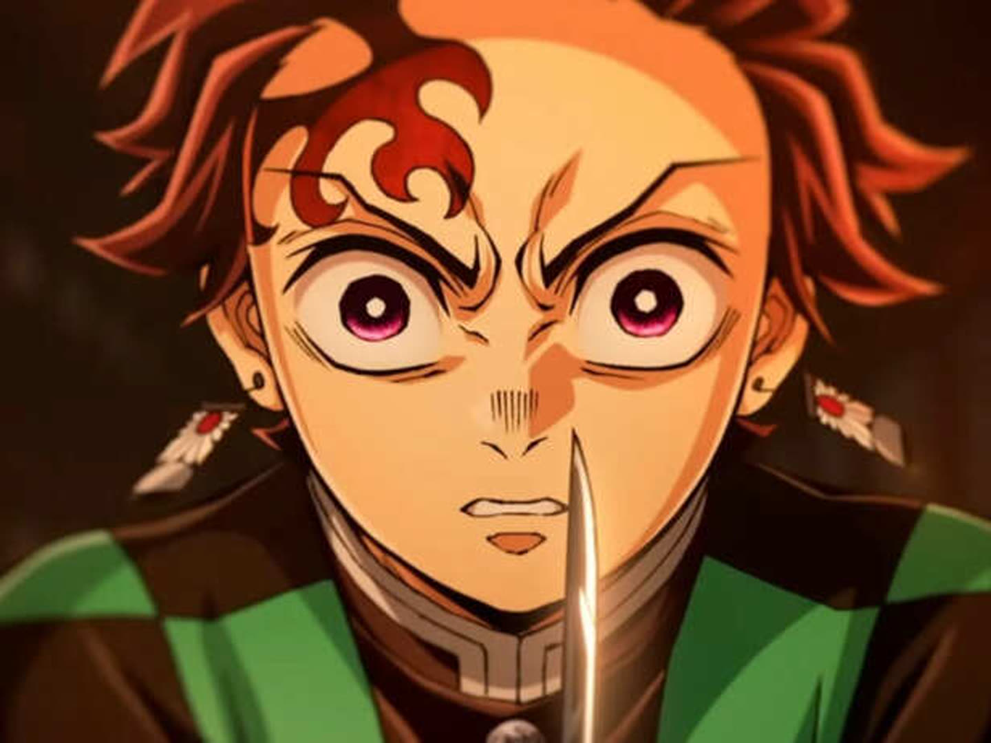 Close up of Tanjiro Kamado from Demon Slayer Eyes Wide with a Blade Held Near His Face in a Dramatic Moment