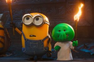 Two Animated Charactersone Yellow Minion in Overalls and a Green Round headed Friendstand in a Dark Cave Each Holding a Lit Torch
