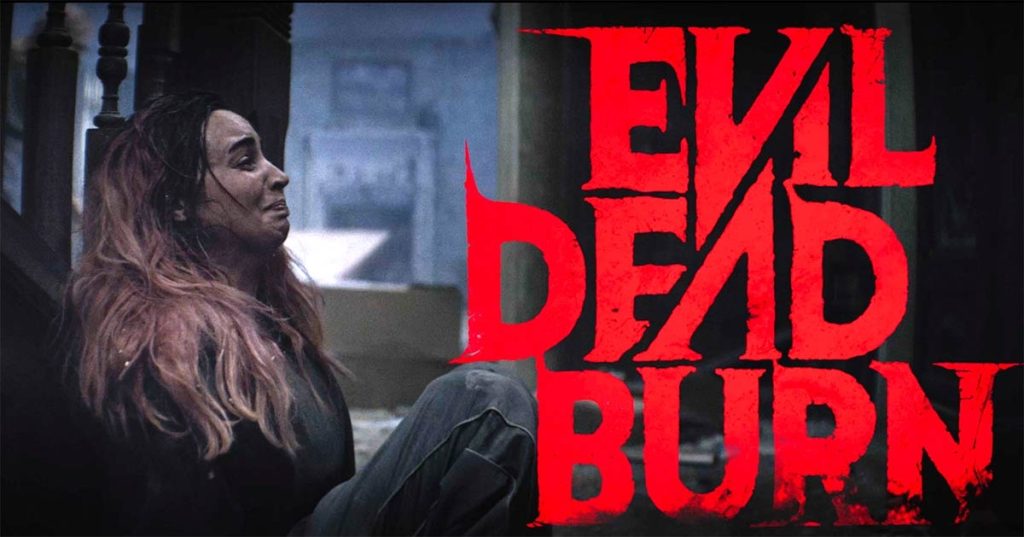 Promotional Poster for Evil Dead Rise Showing a Woman with Pink Hair Sitting Against a Railing on the Left and Bold Red Title on the Right